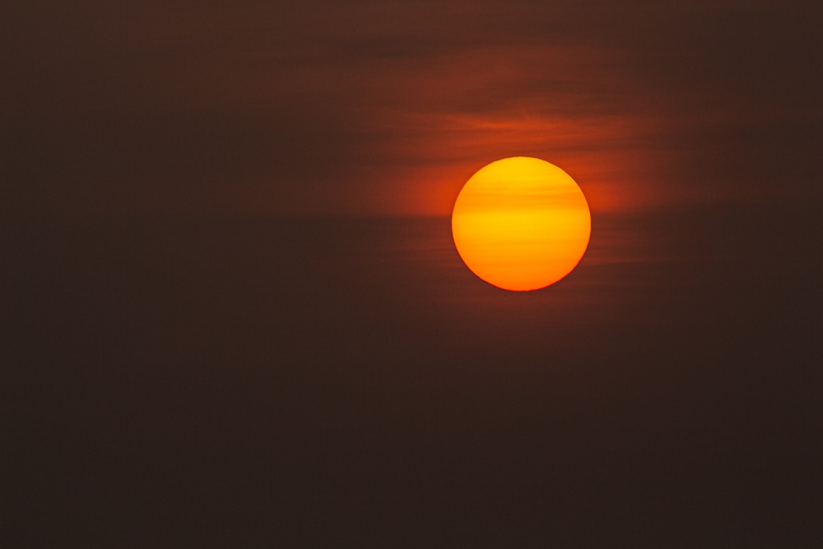 The Sun glowing low through the upper atmosphere